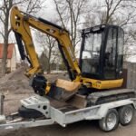 Caterpillar 302.7D avec accessoire + Remorque